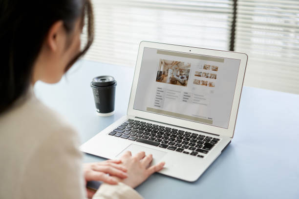 Image of an A Women viewing a website on a computer